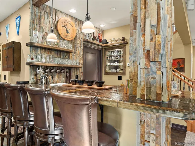 a kitchen with stainless steel appliances granite countertop a stove and cabinets