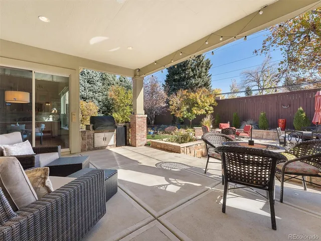 a view of a patio with couple of chairs