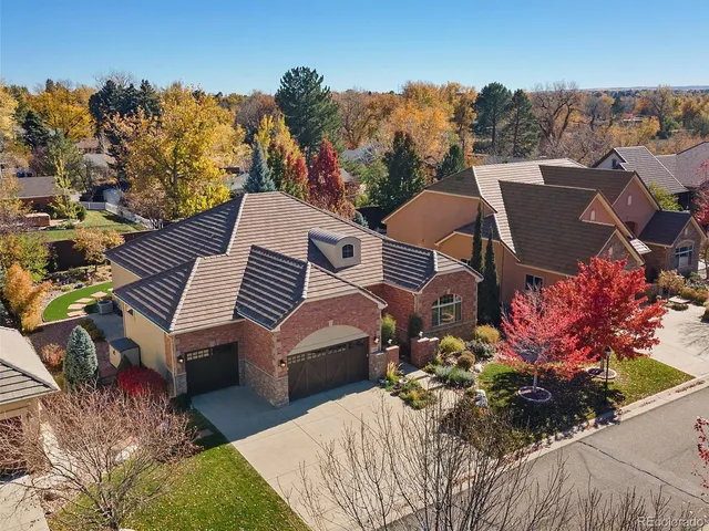an aerial view of a residential houses with outdoor space