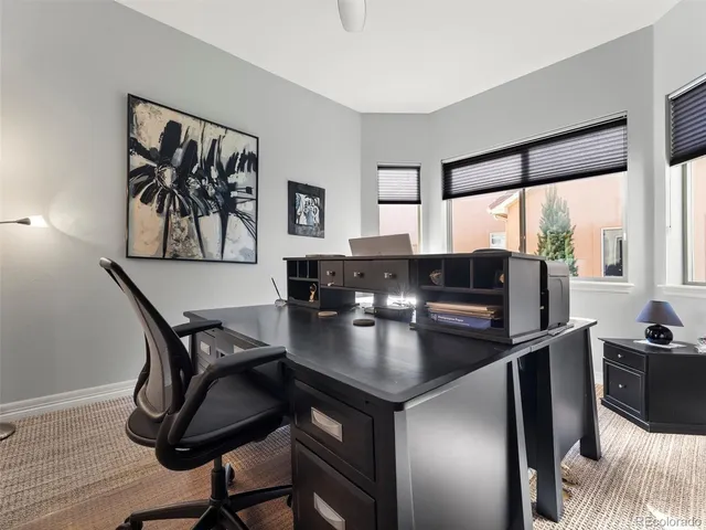 a kitchen with a table chairs and microwave