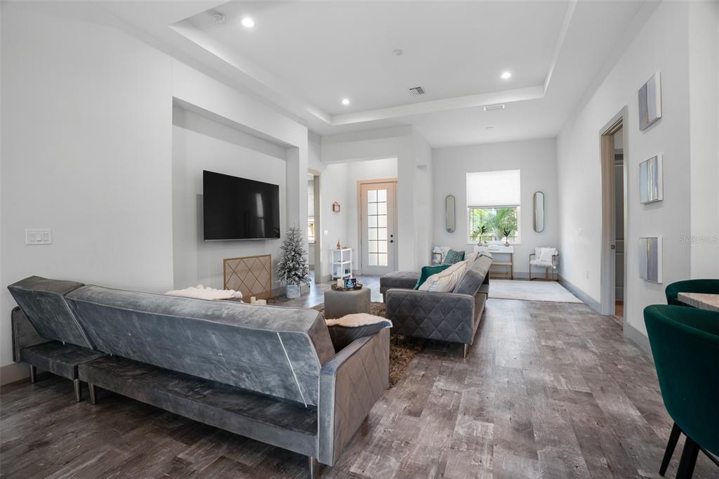 4528 Libby Road North Port, FL 34287 - Photo 11 of 43 a bedroom with furniture and a flat screen tv