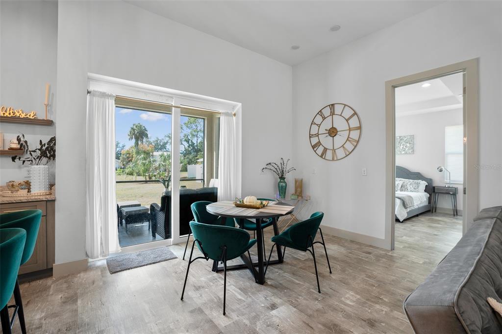 4528 Libby Road North Port, FL 34287 - Photo 12 of 43 a view of a dining room with furniture window and wooden floor