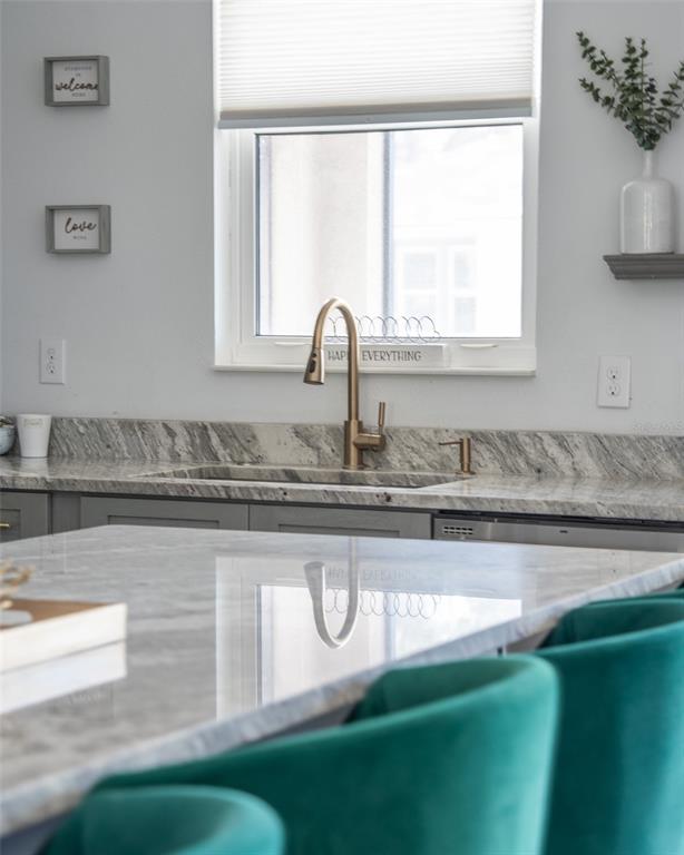 4528 Libby Road North Port, FL 34287 - Photo 18 of 43 a close view of sink and a dishwasher with wooden floor