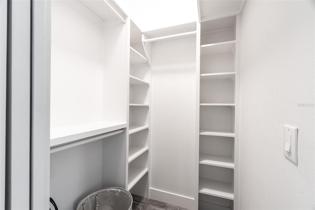 4528 Libby Road North Port, FL 34287 - Photo 27 of 43 a view of walk in closet with empty racks