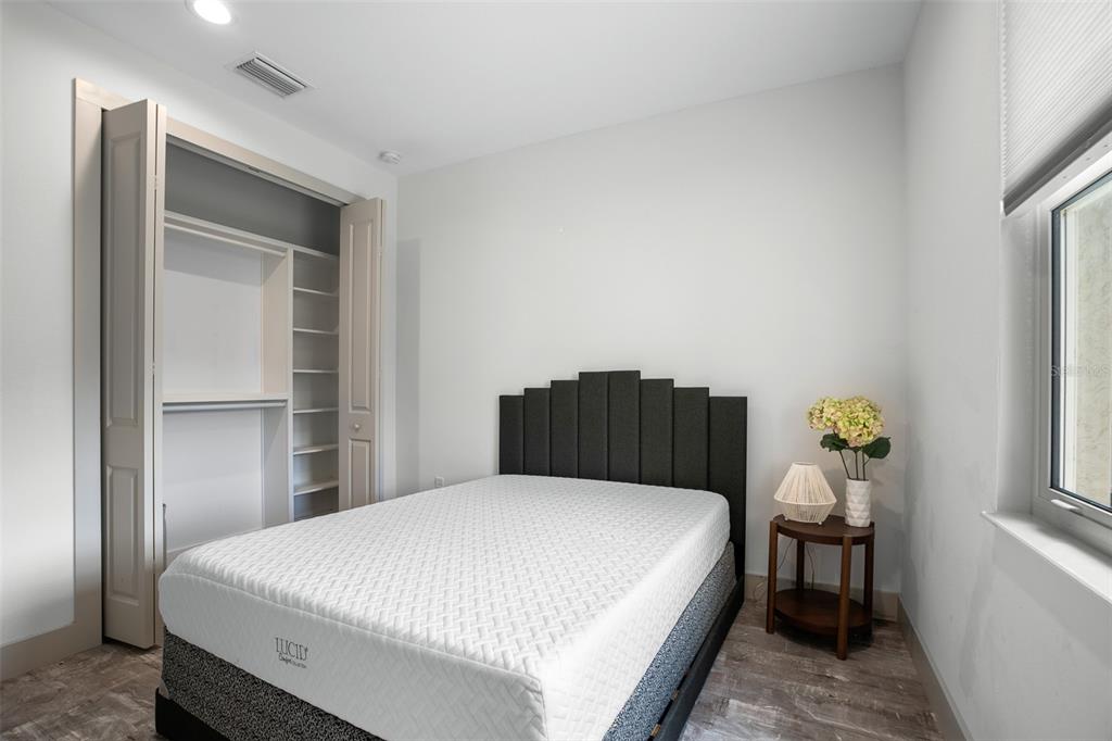 4528 Libby Road North Port, FL 34287 - Photo 33 of 43 a bedroom with a bed table and window