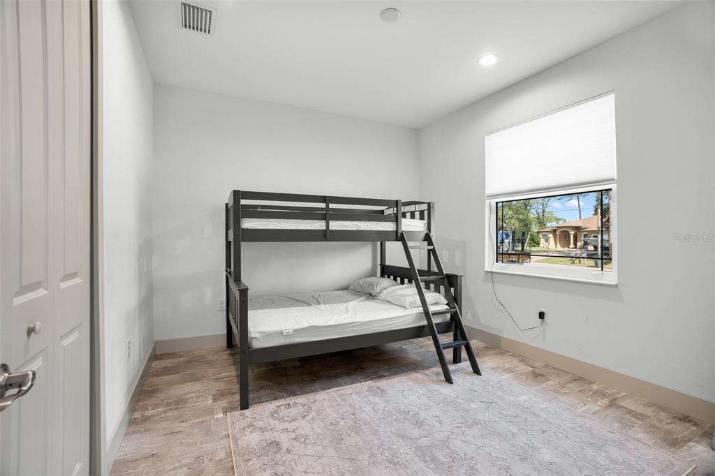 4528 Libby Road North Port, FL 34287 - Photo 34 of 43 a bedroom with a bed and a window