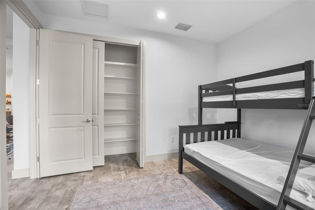 4528 Libby Road North Port, FL 34287 - Photo 35 of 43 a bedroom with a bed and a cabinet