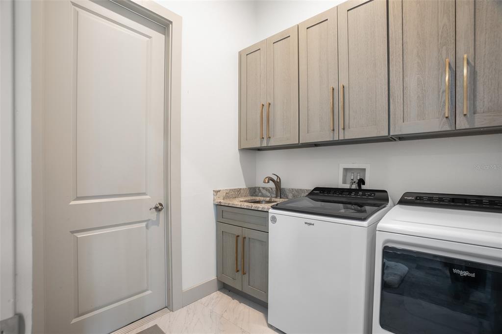 4528 Libby Road North Port, FL 34287 - Photo 36 of 43 a view of a kitchen with washer and dryer
