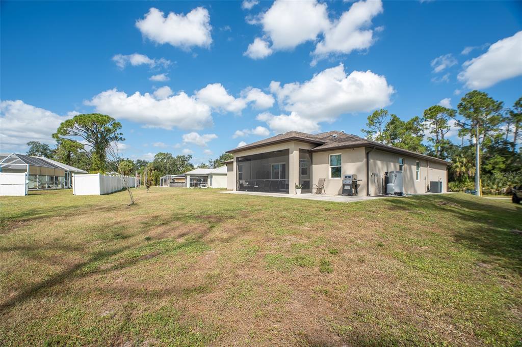 4528 Libby Road North Port, FL 34287 - Photo 37 of 43 a view of a house with a yard