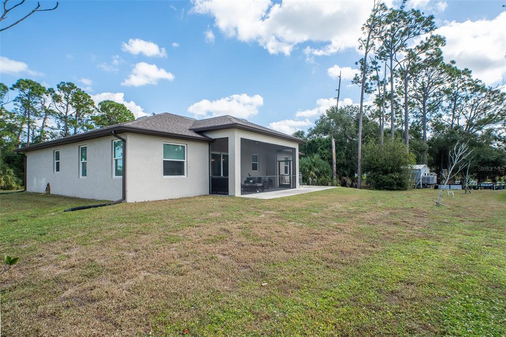 4528 Libby Road North Port, FL 34287 - Photo 38 of 43 a view of a house with a backyard