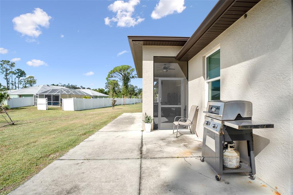 4528 Libby Road North Port, FL 34287 - Photo 39 of 43 a outdoor space with lots of tables chairs and a yard