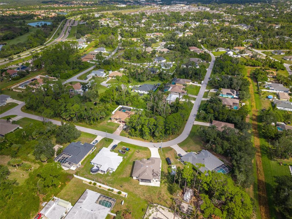 4528 Libby Road North Port, FL 34287 - Photo 42 of 43 an aerial view of a residential houses with yard