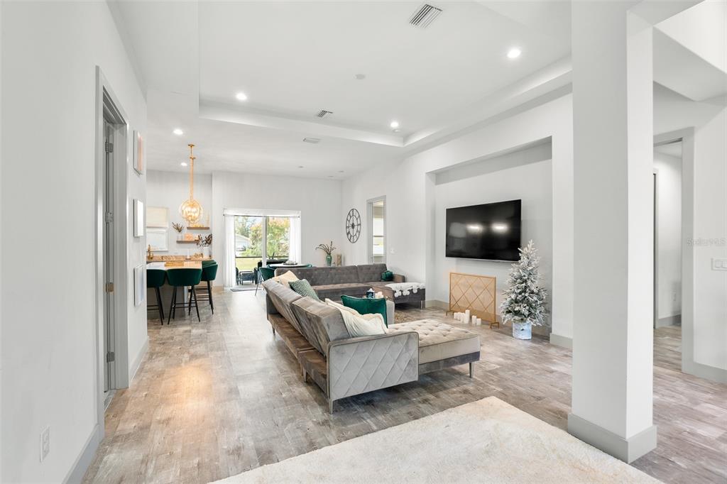 4528 Libby Road North Port, FL 34287 - Photo 10 of 43 a living room with furniture and a flat screen tv