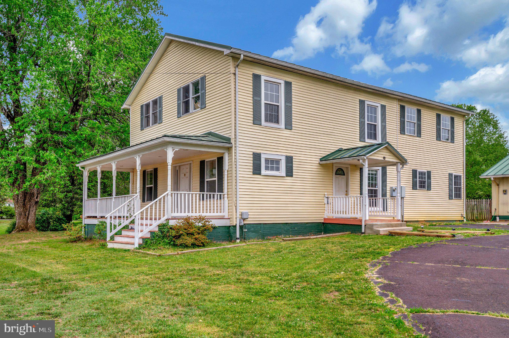 23202 Village Road Unionville, VA 22567 - Photo 48 of 58 a front view of a house with a yard