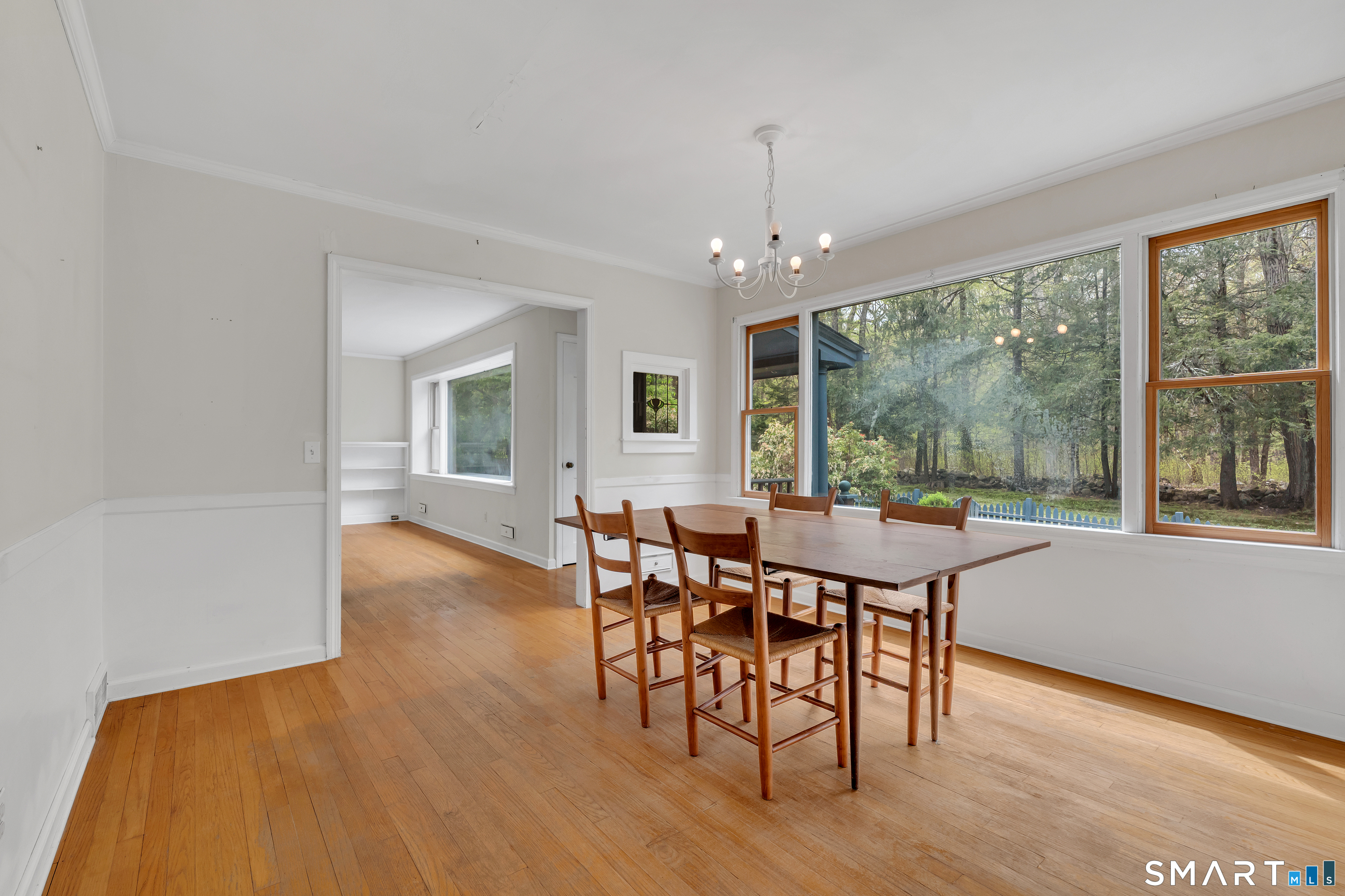 148 Old Redding Road Redding, CT 06896 - Photo 12 of 39 a view of a dining room with furniture window and wooden floor