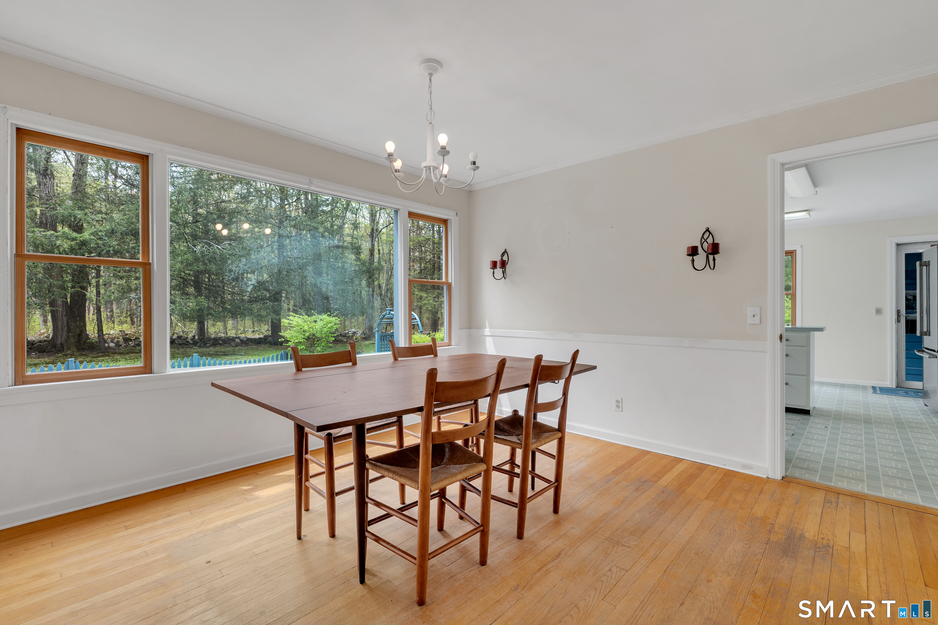 148 Old Redding Road Redding, CT 06896 - Photo 13 of 39 a view of a dining room with furniture window and wooden floor