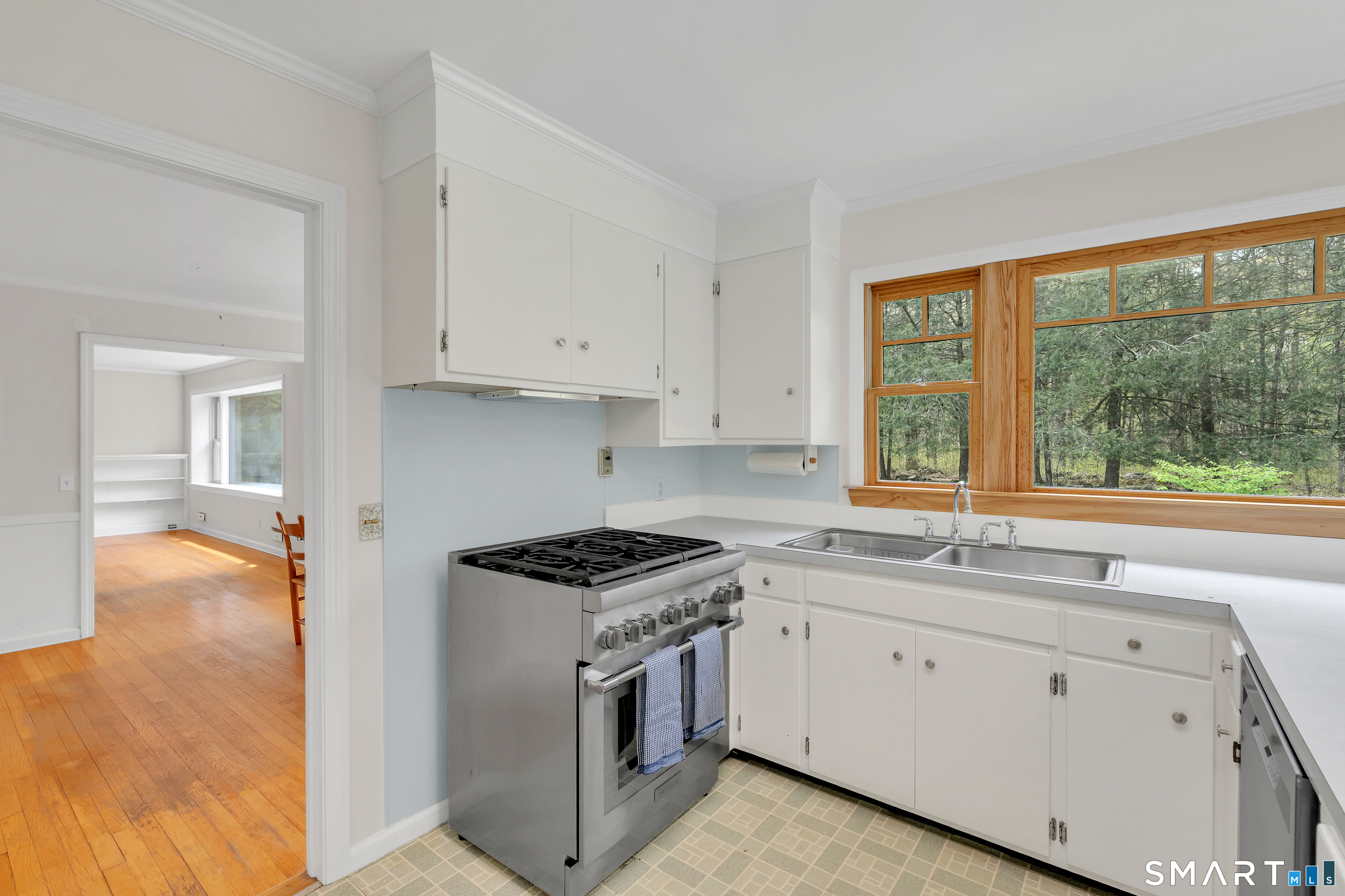 148 Old Redding Road Redding, CT 06896 - Photo 14 of 39 a kitchen with white cabinets and a stove