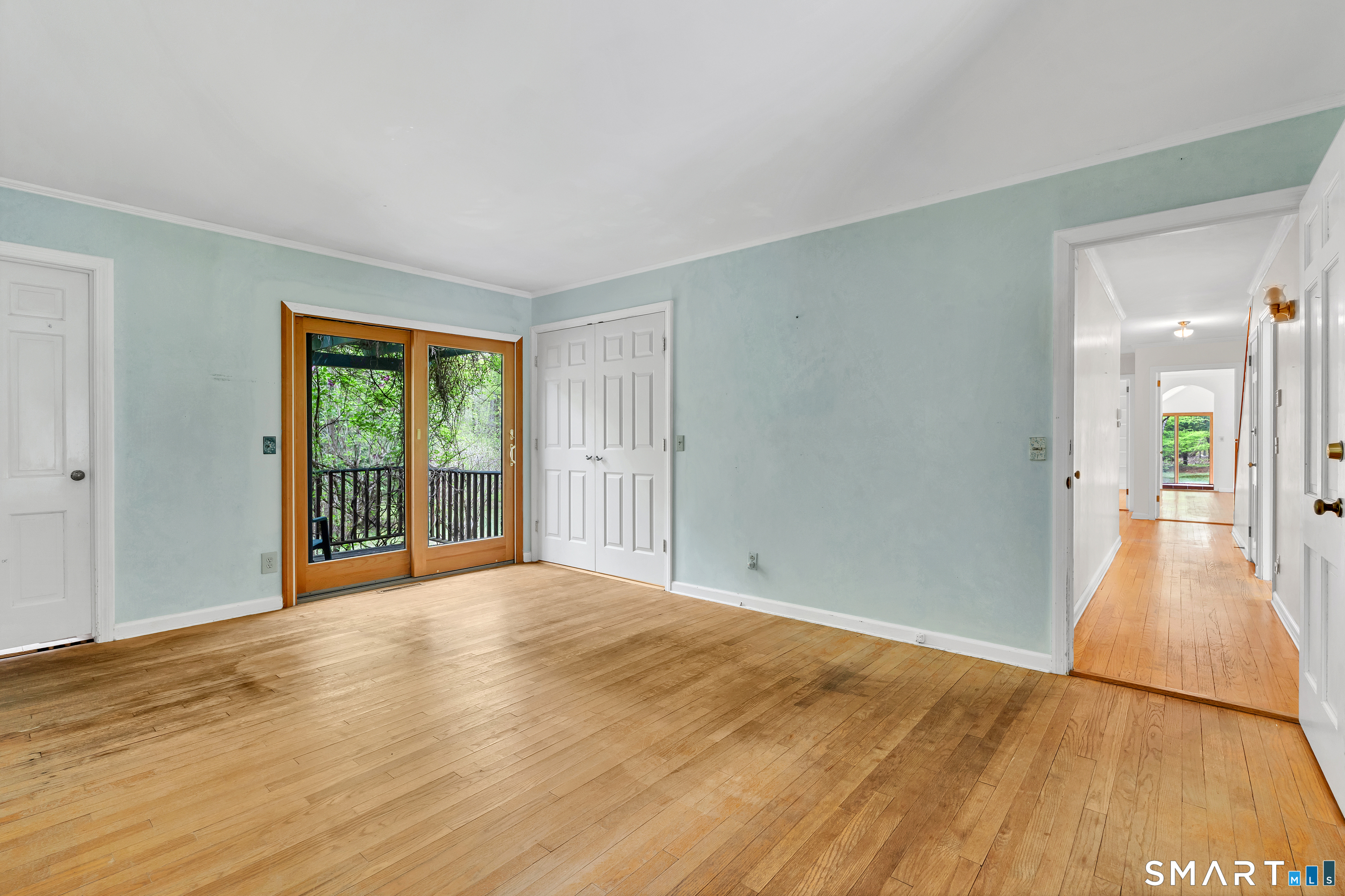 148 Old Redding Road Redding, CT 06896 - Photo 19 of 39 a view of a big room with wooden floor and windows