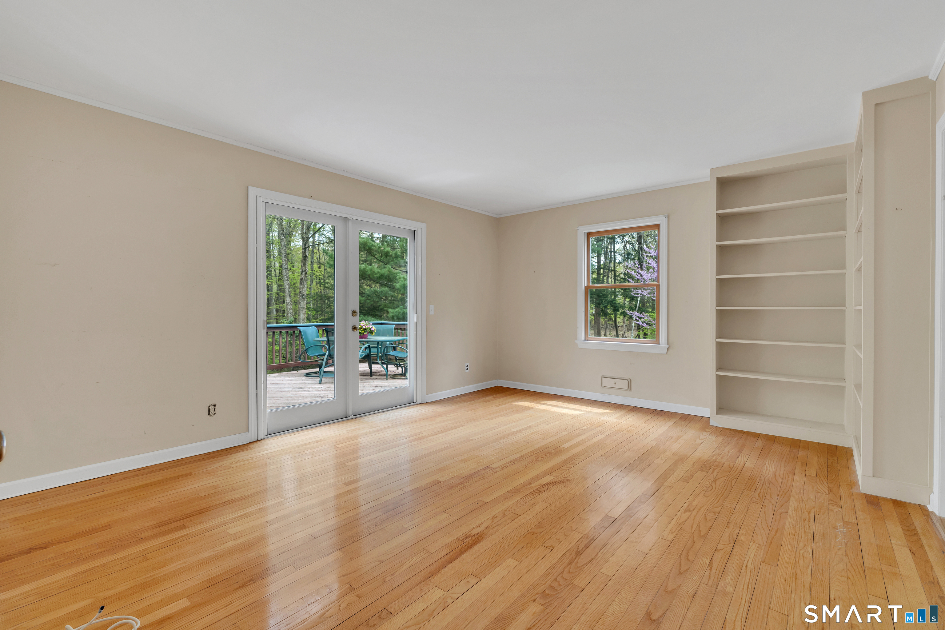 148 Old Redding Road Redding, CT 06896 - Photo 23 of 39 wooden floor in an empty room with a window