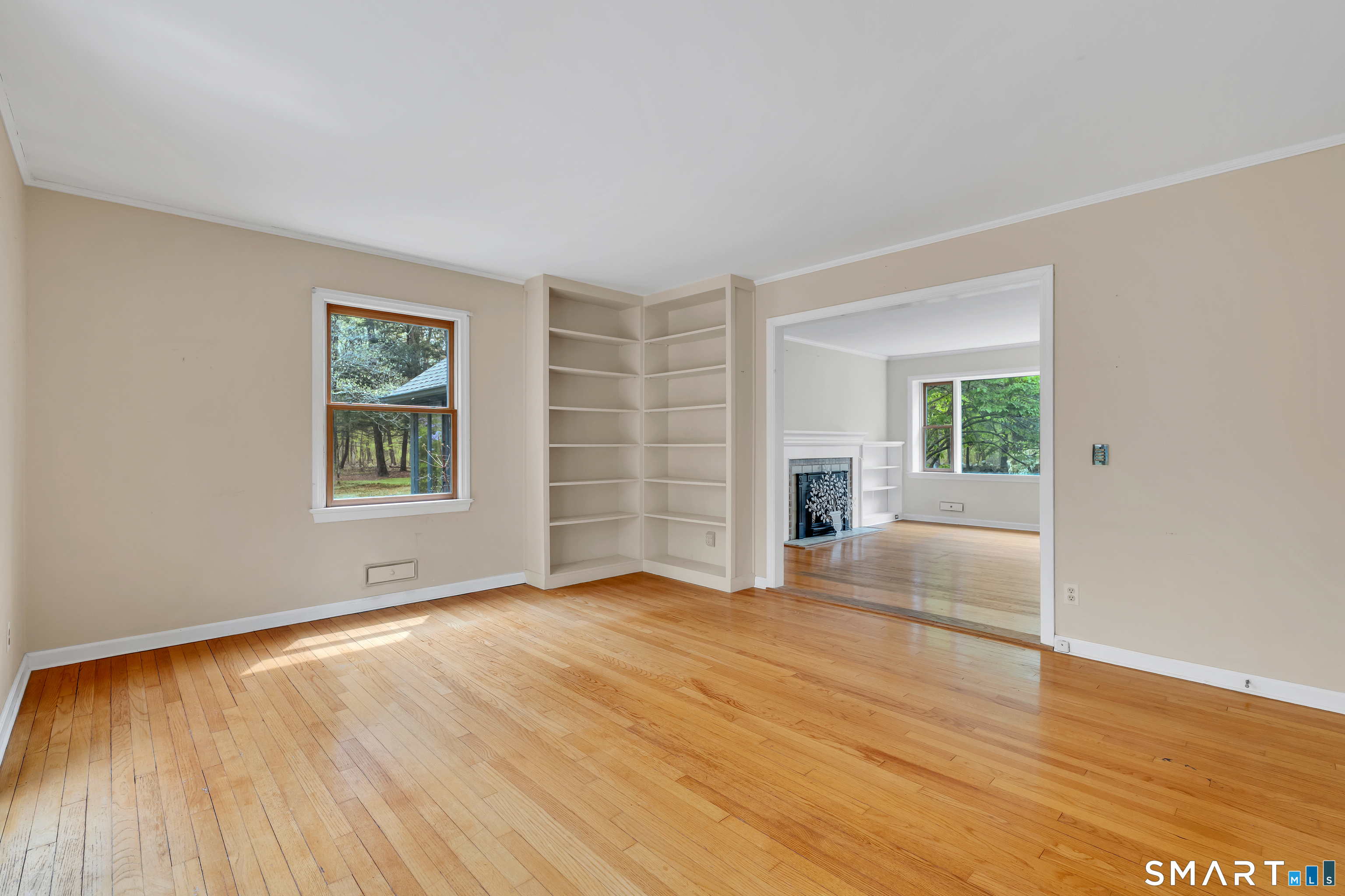 148 Old Redding Road Redding, CT 06896 - Photo 24 of 39 an empty room with wooden floor and windows