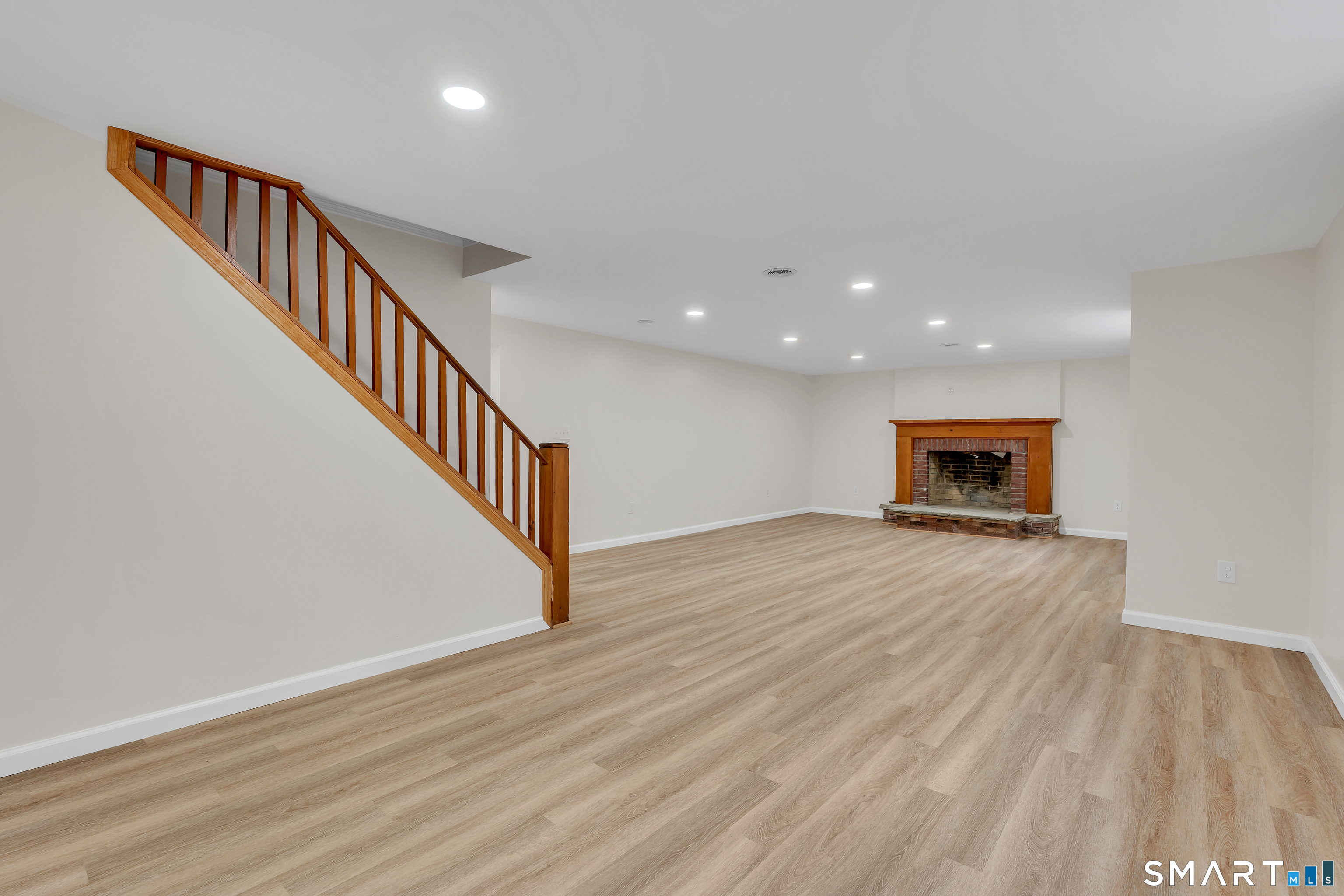 148 Old Redding Road Redding, CT 06896 - Photo 31 of 39 a view of a hallway with wooden floor and staircase