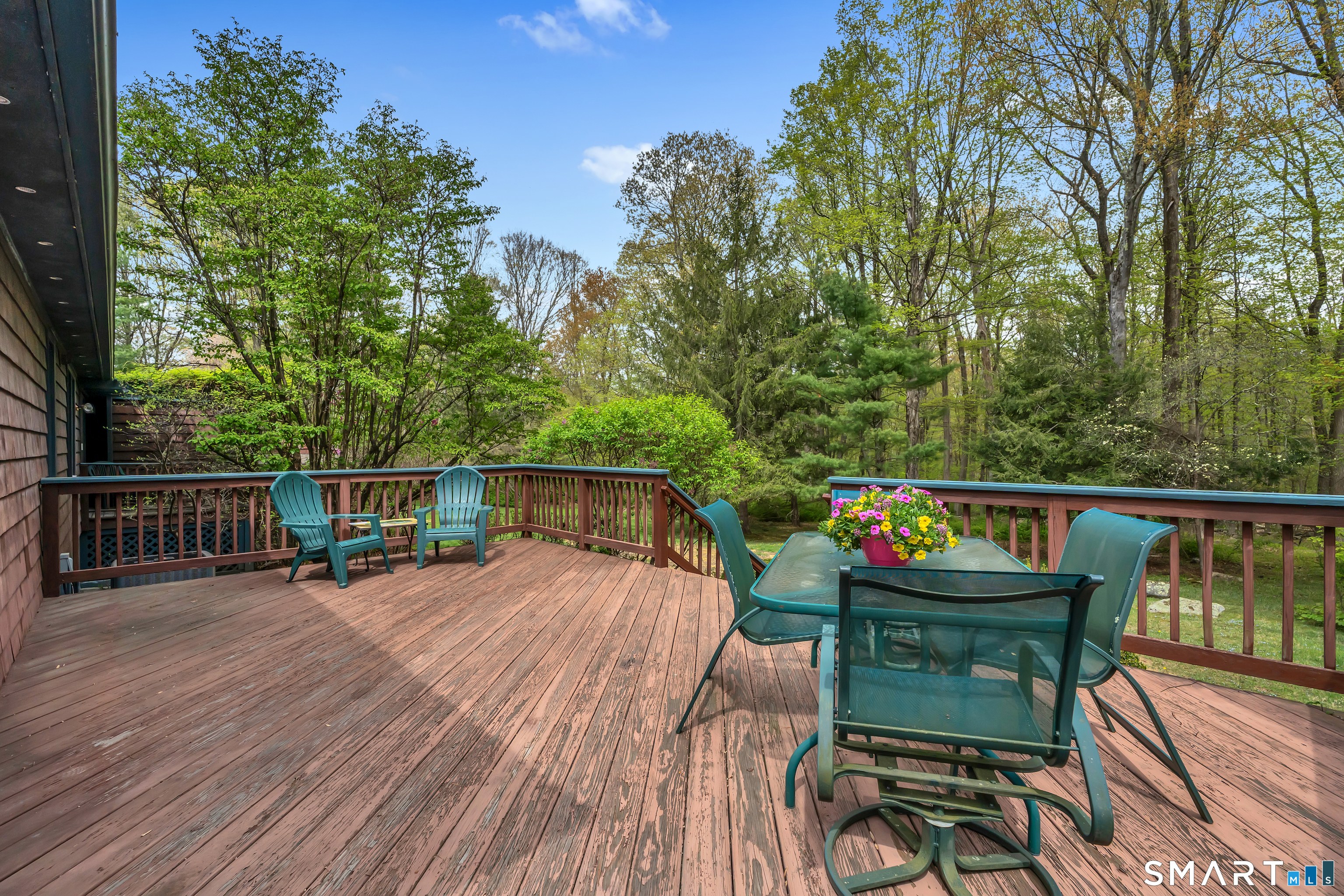 148 Old Redding Road Redding, CT 06896 - Photo 38 of 39 a view of balcony with furniture and trees in the background