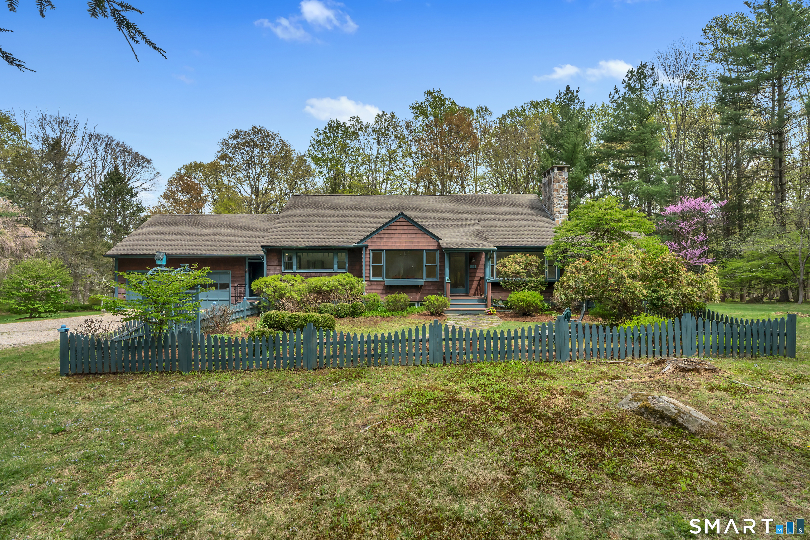 148 Old Redding Road Redding, CT 06896 - Photo 4 of 39 a front view of a house with a yard