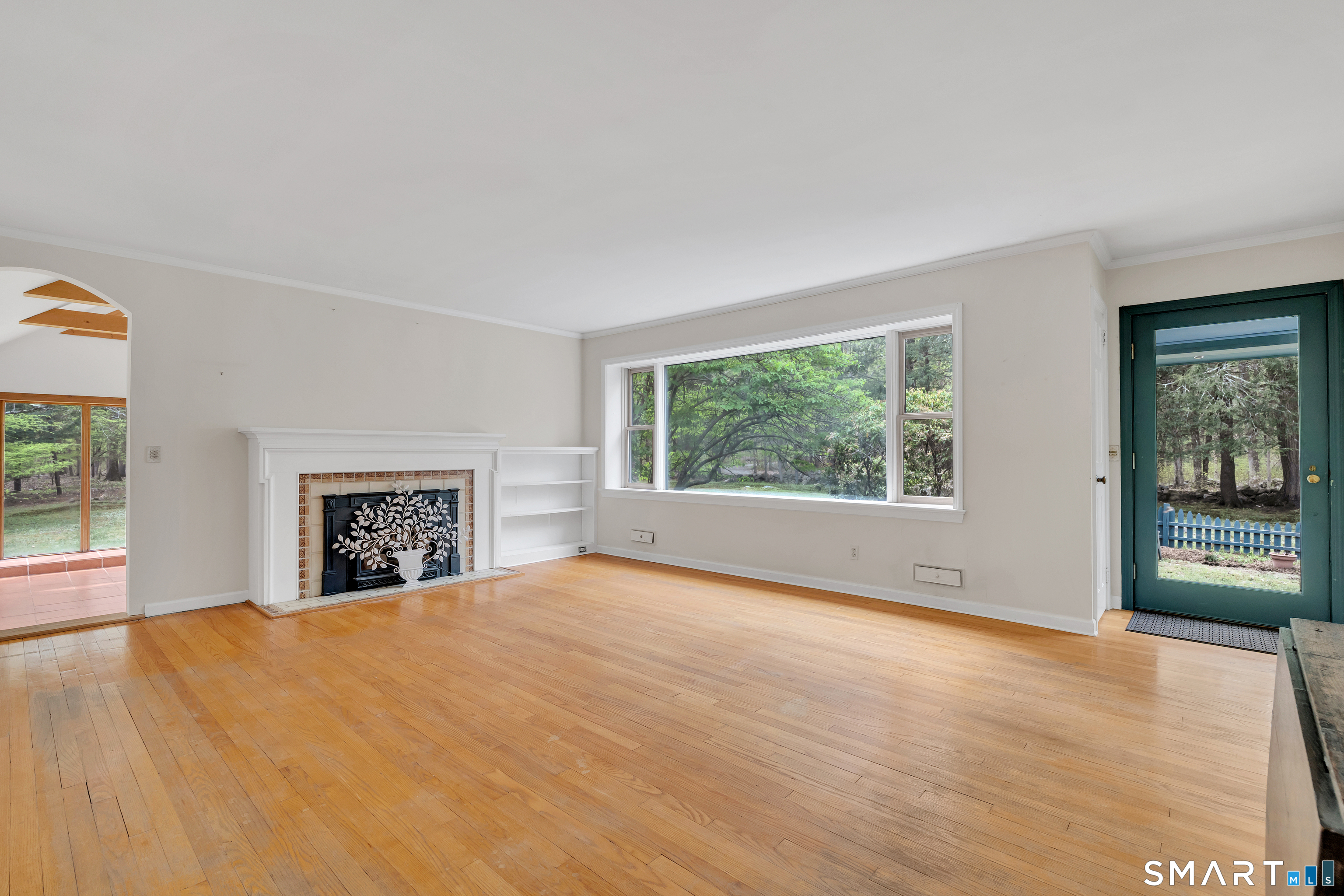 148 Old Redding Road Redding, CT 06896 - Photo 9 of 39 a view of an empty room with a window and wooden floor