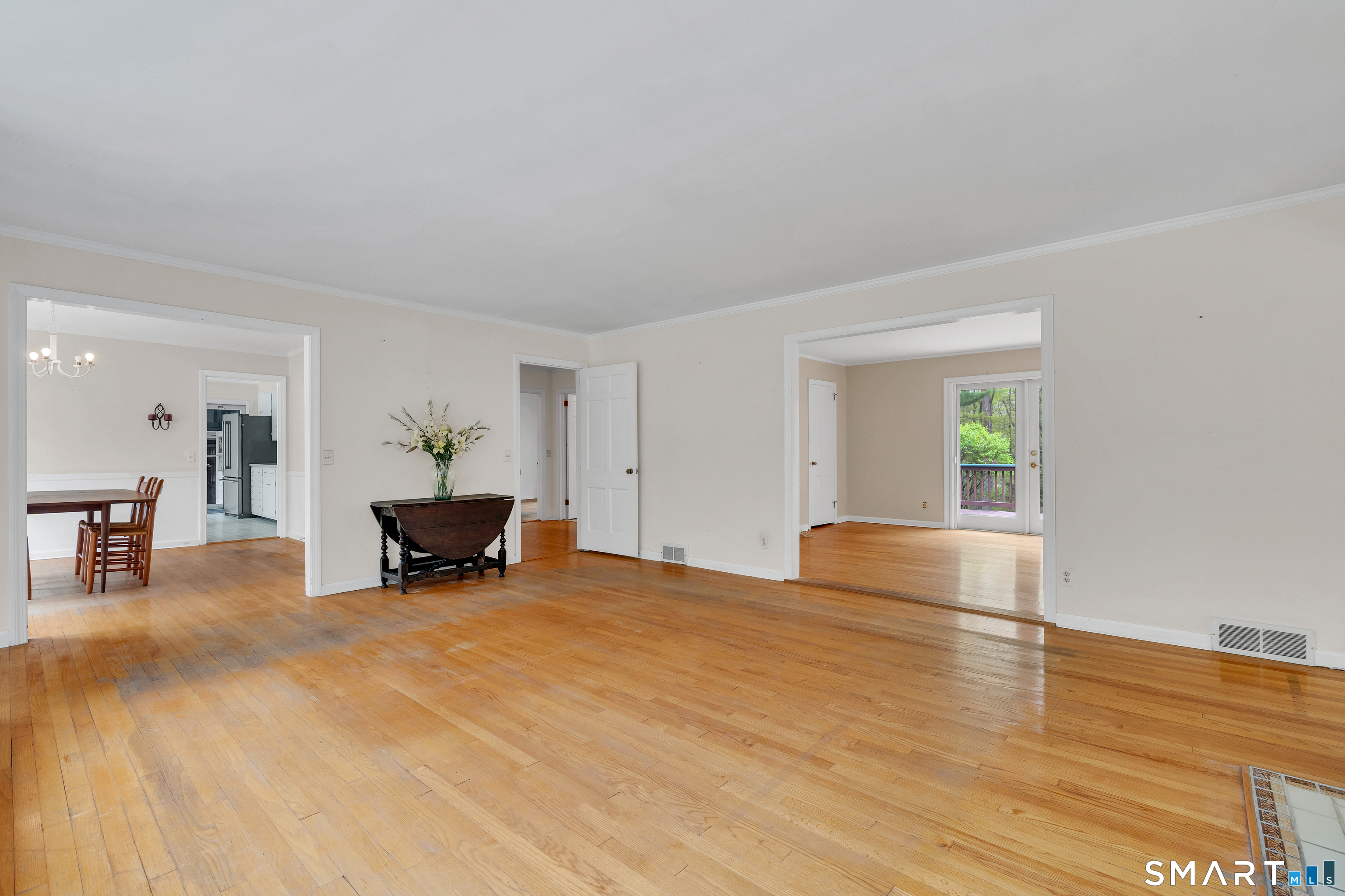 148 Old Redding Road Redding, CT 06896 - Photo 10 of 39 a view of an empty room with wooden floor and furniture