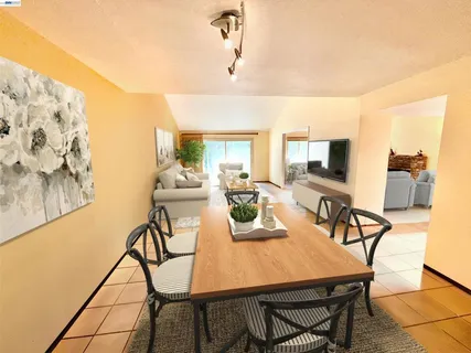 a spacious bedroom with a bed and a couch