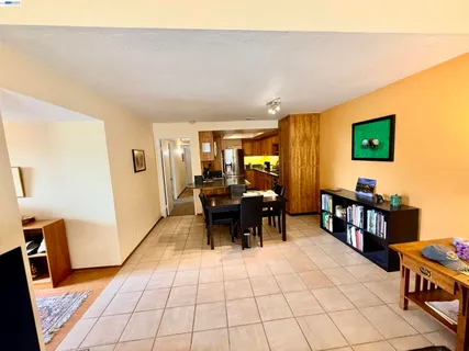 a living room with furniture a rug and a window