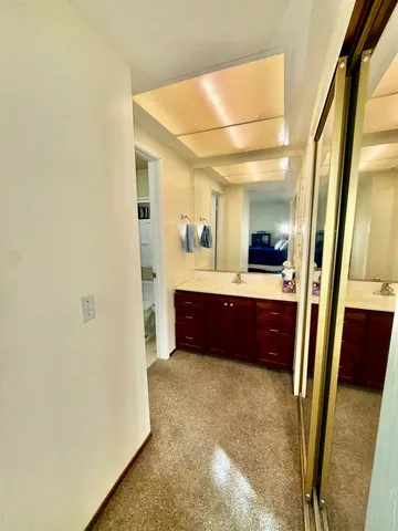 a large bathroom with a double vanity sink and a mirror
