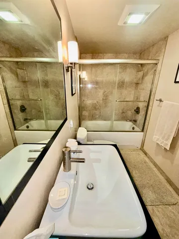 a bathroom with a bathtub and a toilet