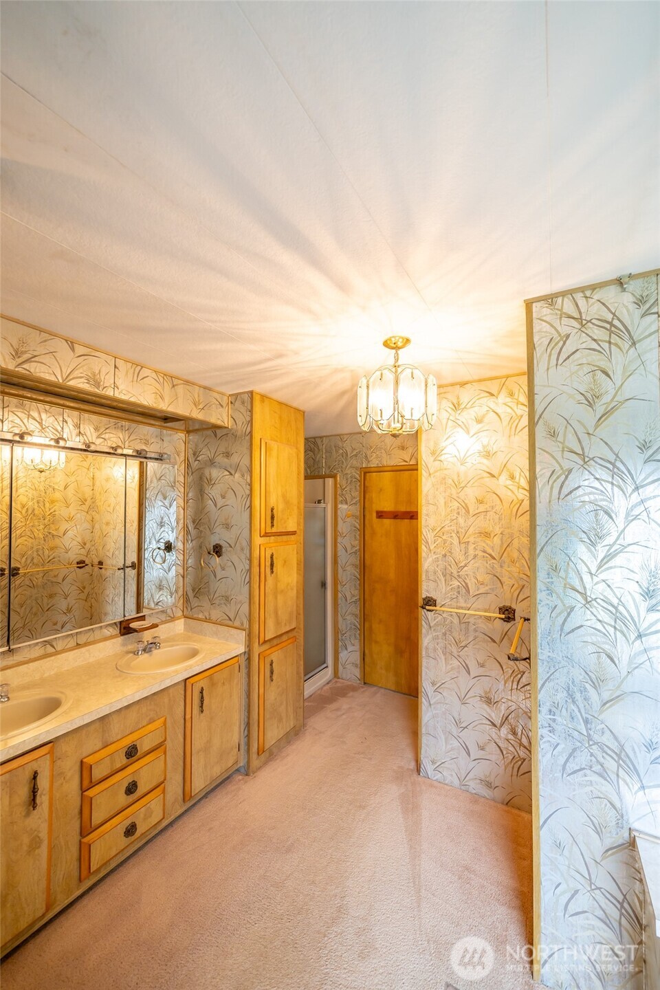 57 Clemons Road, Unit 71 Montesano, WA 98563 - Photo 12 of 26 a spacious bathroom with a double vanity sink a mirror and a shower