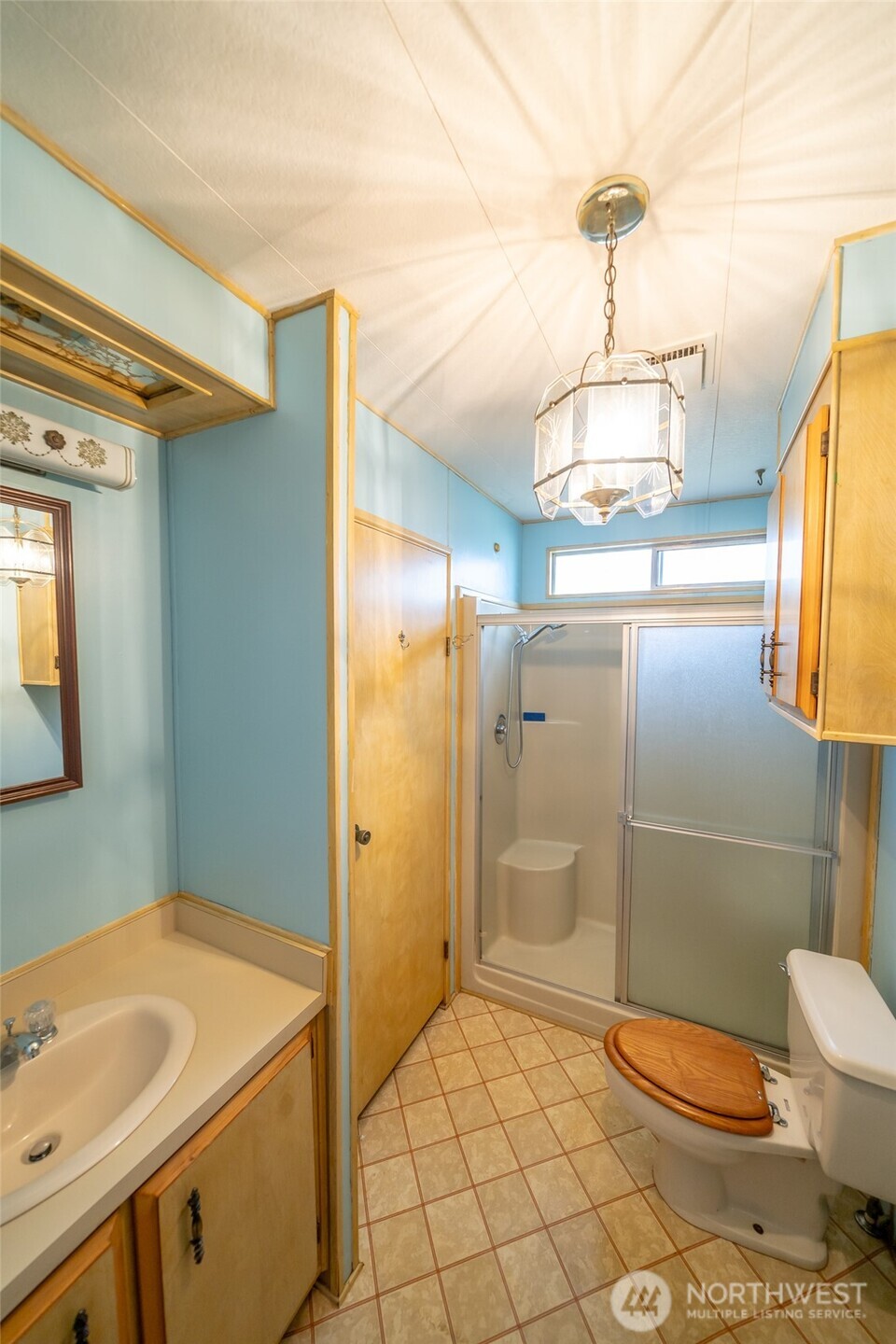 57 Clemons Road, Unit 71 Montesano, WA 98563 - Photo 19 of 26 a bathroom with a sink a toilet and shower