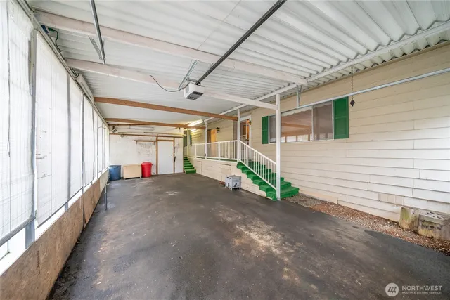 a view of hallway with wooden floor