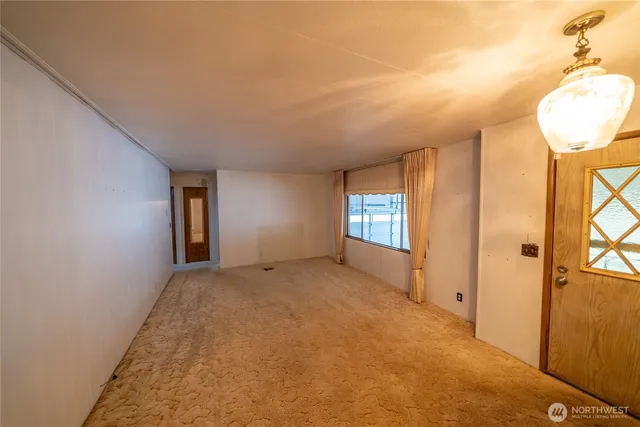 a view of an empty room and window