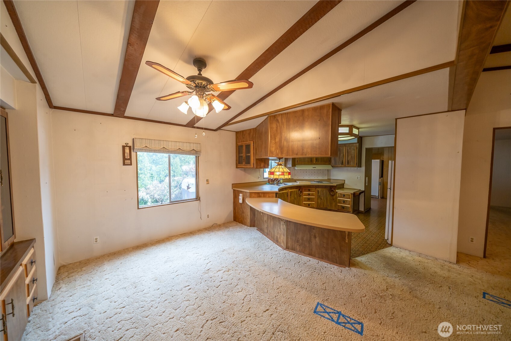 57 Clemons Road, Unit 71 Montesano, WA 98563 - Photo 6 of 26 a large room with a couch and a ceiling fan