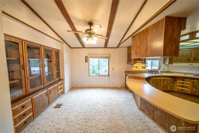 a view of a kitchen with a sink and dishwasher