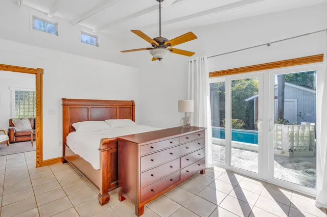 a bedroom with a bed and a mirror