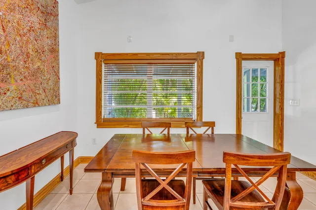 a dining room with table and chairs