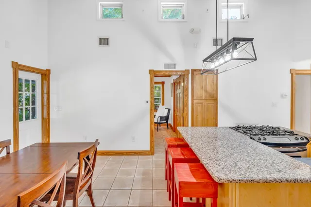 a dining room with a table and chairs
