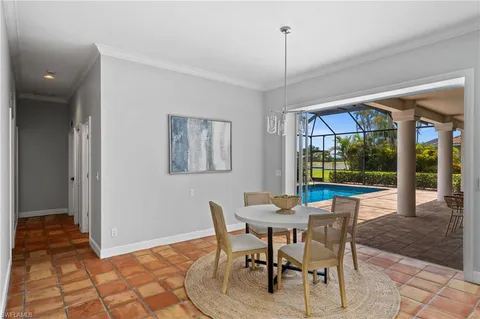 a view of a dining room with furniture wooden floor and garden