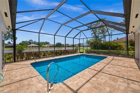 a view of a swimming pool with a porch