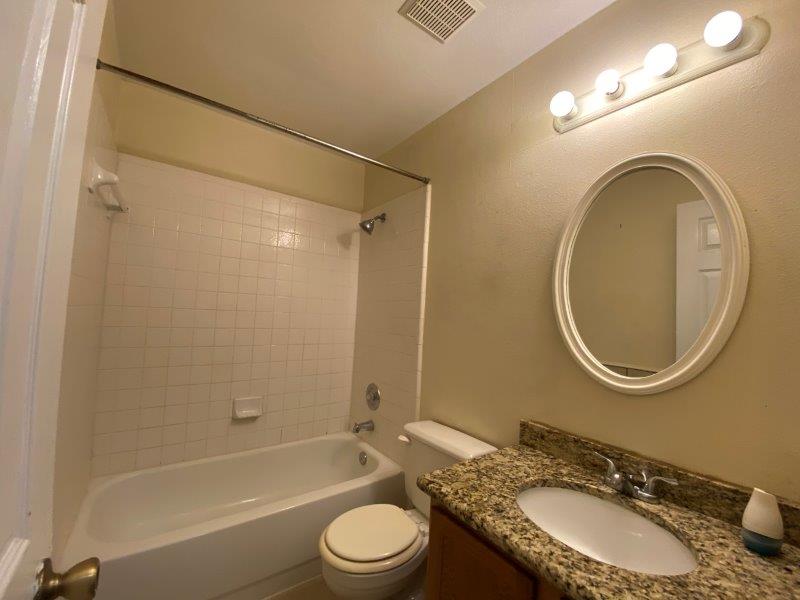 1903 Balsam Way Round Rock, TX 78665 - Photo 14 of 21 Granite counters and a tiled shower-bath combination outfit this functional bathroom #2.