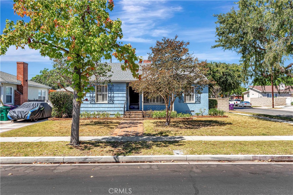 1949 Chatwin Avenue Long Beach, CA 90815 - Photo 1 of 3 a view of a house with street that has a tree
