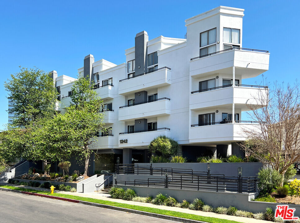 a front view of a building with street view
