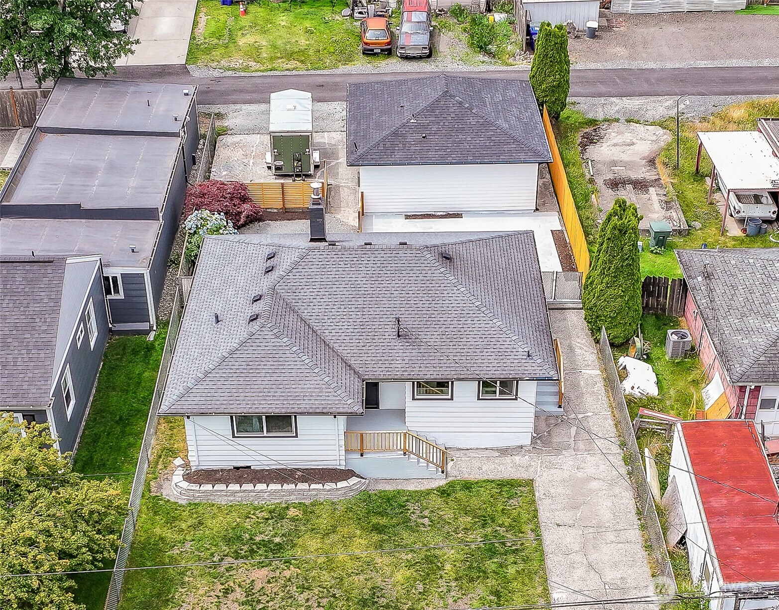 6218 Rockefeller Avenue Everett, WA 98203 - Photo 1 of 1 an aerial view of a house with garden space and a car parked