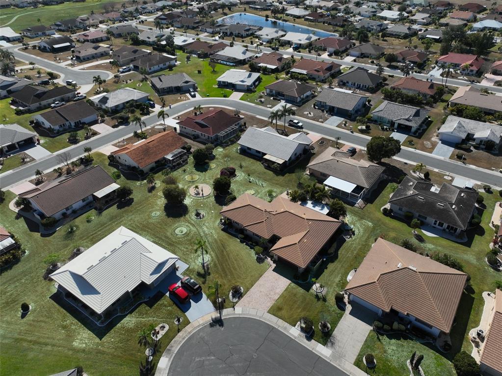 705 Baltusrol Way Sun City Center, FL 33573 - Photo 12 of 59 an aerial view of residential houses with outdoor space