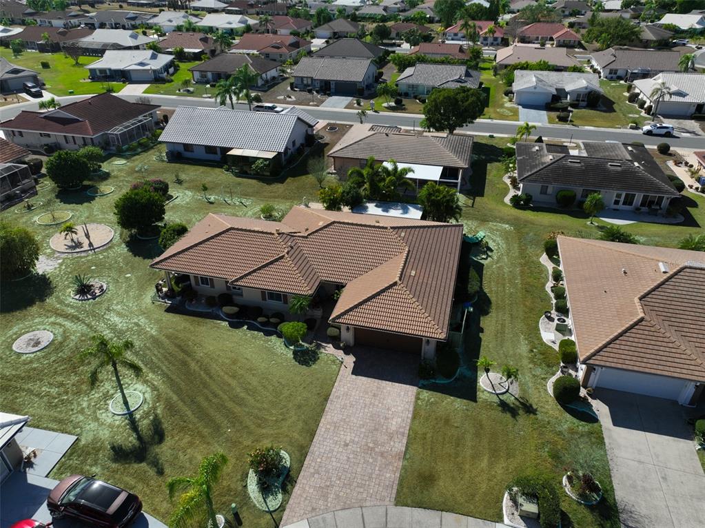 705 Baltusrol Way Sun City Center, FL 33573 - Photo 2 of 59 an aerial view of residential houses with outdoor space